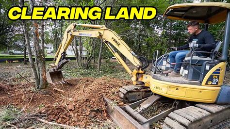 clearing land with an excavator